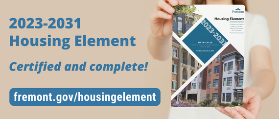 person holding cover of Housing Element. In text: 2023-2031 Housing Element, Certified and complete! fremont.gov/housingelement