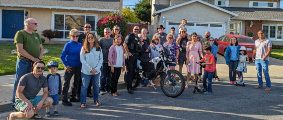 community members at Fremont National Night Out party with Fremont Police Department officer