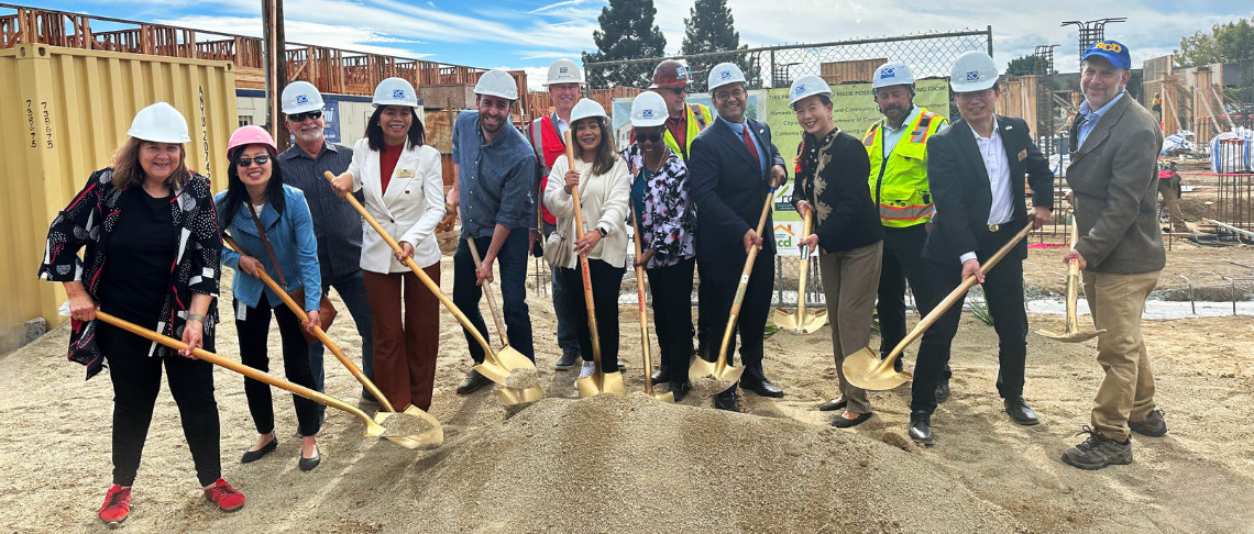City officials and RCD representatives holding shovels with dirt at groundbreaking for new affordable housing development, Bell Street Gardens
