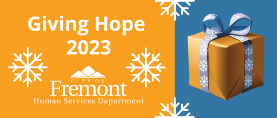 present wrapped with blue snowflakes on ribbon, snowflakes, with Giving Hope 2023 City of Fremont Human Services in text