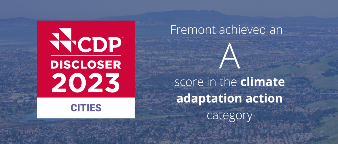Fremont aerial in background. In text: CDP Discloser 2023 Cities. Fremont achieved an A score in climate adaption category.
