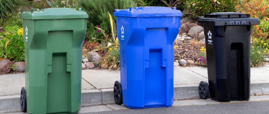 Garbage, recycling, and composting carts set out at the curb