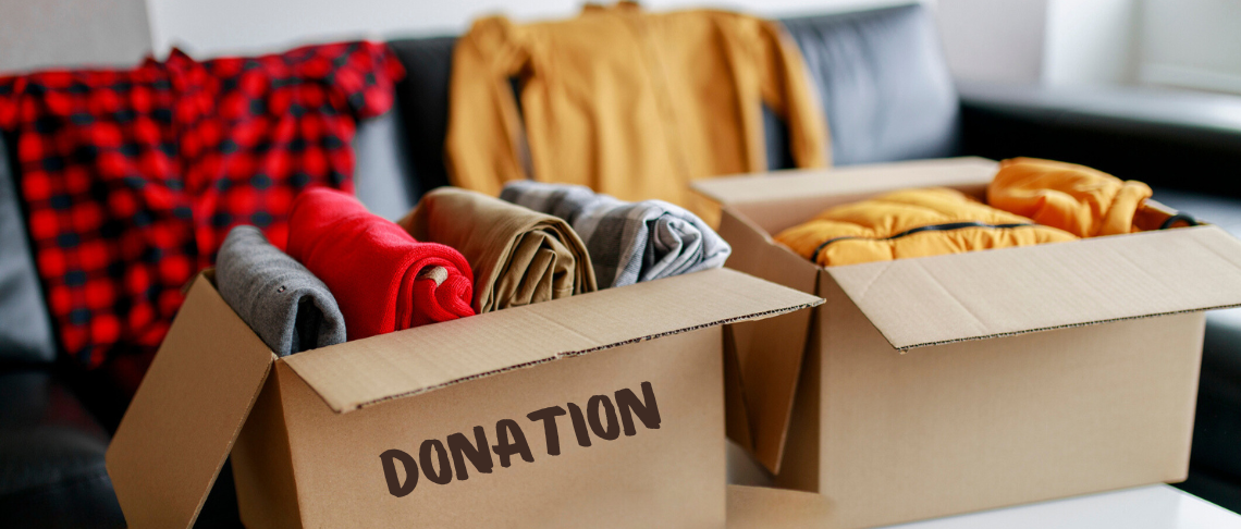 cardboard boxes filled with clothes to donate