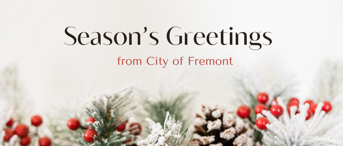 pinecones, snow, branches, and berries. In text: Season's Greetings from the City of Fremont