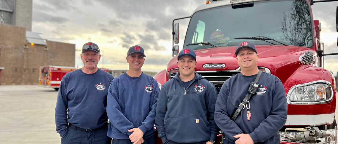 four Fremont firefighters in front of Engine 354