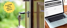 key in open door and laptop with application on screen