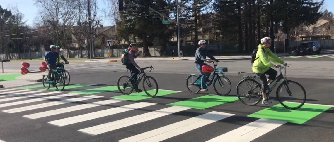 cyclists riding in bike line