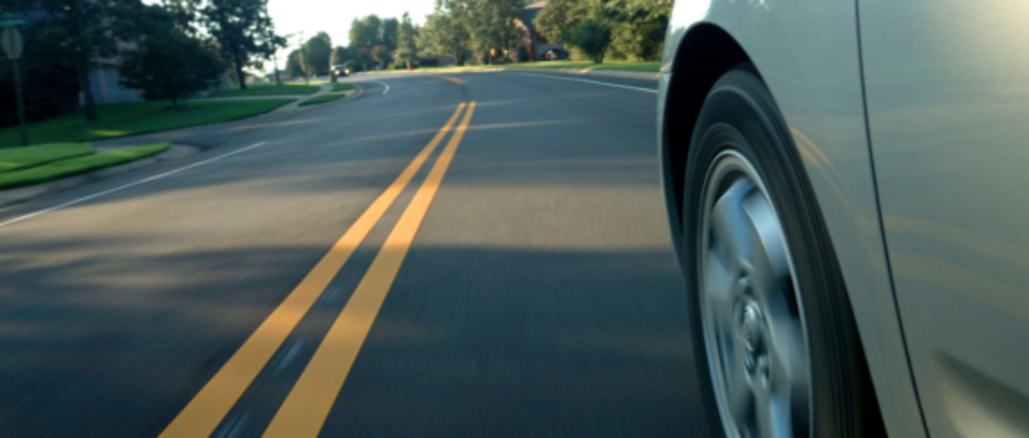 car driving on roadway
