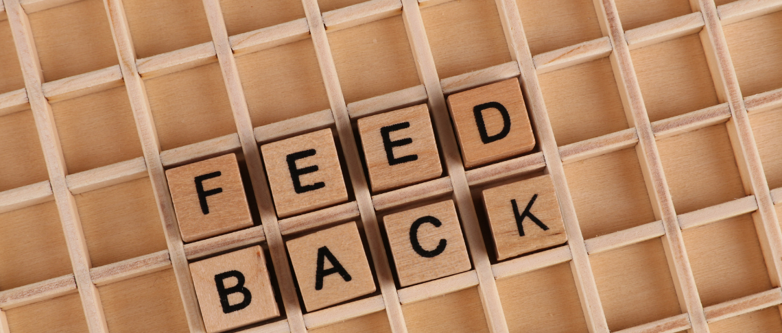Feedback spelled out in wooden blocks
