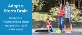 family holding brooms working on their adopted storm drain to keep it debris free.