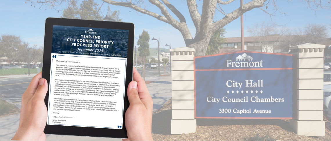 Holding a tablet reading Council Priorities