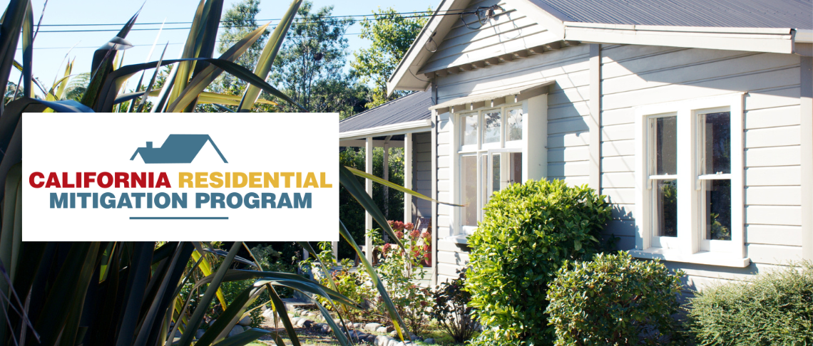 Front of a single family residential house with windows, bushes