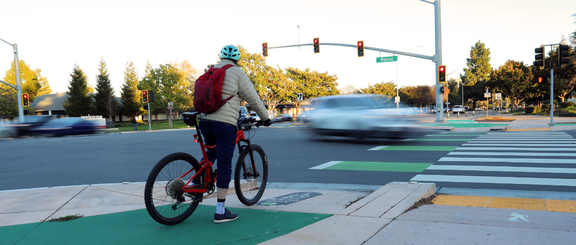 Person on bike at intersection