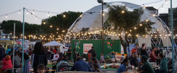 People gathering in Downtown Fremont at dusk