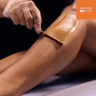 Soft wax being applied to a leg