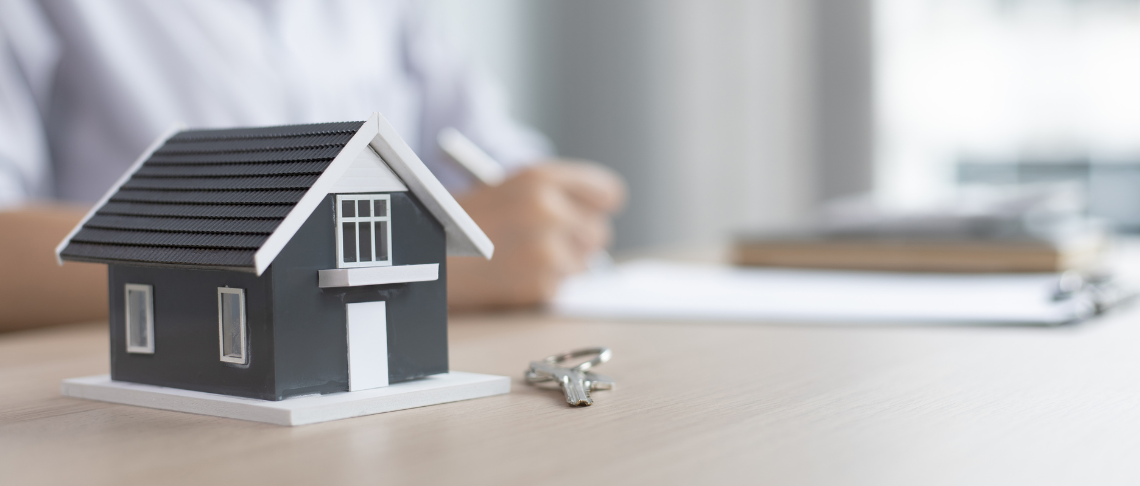 House with set of keys in foreground