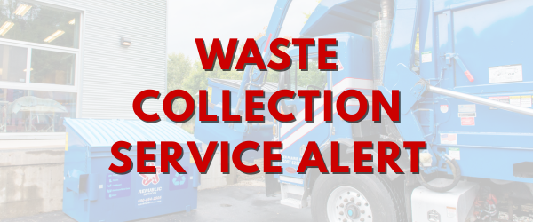 Blue garbage truck emptying dumpster