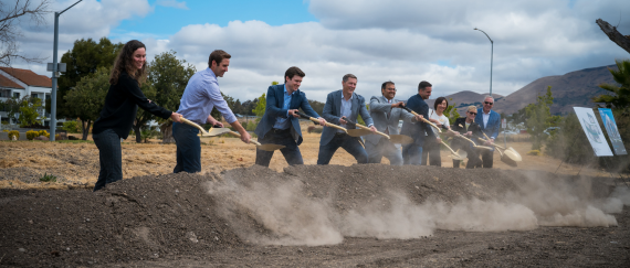 Groundbreaking Event, photo of stakeholders with shovels and dirt