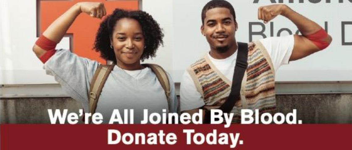 two people standing proud after giving blood. We're all joined by blood. Give today.