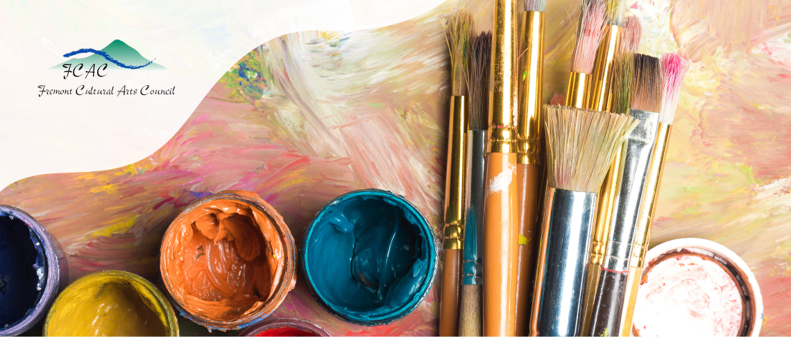 Colorful acrylic pant pots with a stack of painting brushes