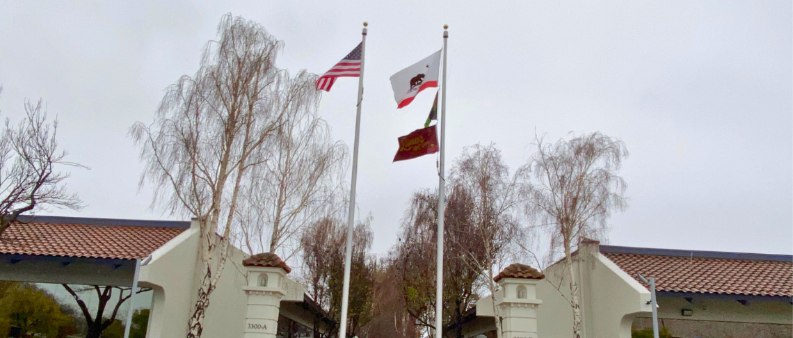 USA, California, and Lunar New Year flag raised in front of City Hall offices