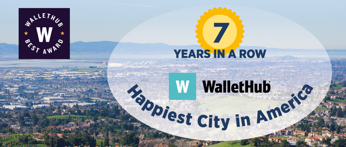 Aerial view of Fremont and the baylands, with text: 7 Years in a Row. Happiest City in America.