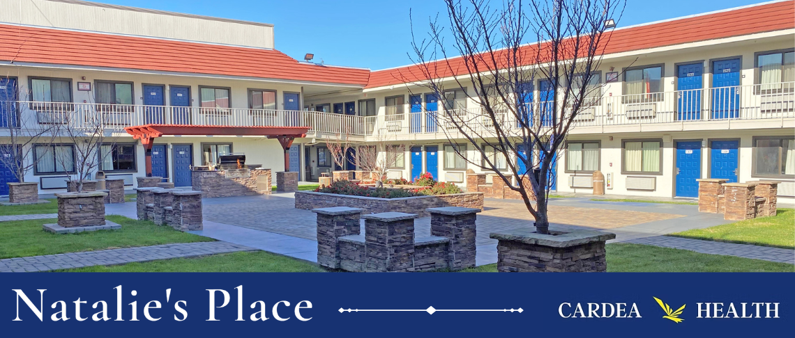 Natalie's Place, a multifamily two-story structure with a courtyard garden and blue sky.
