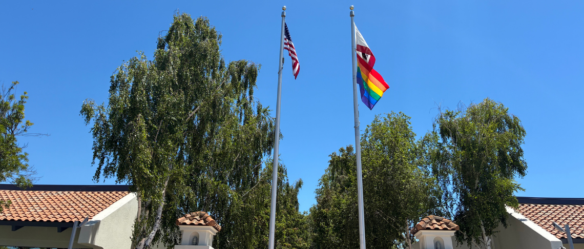 United States & Pride Flag above City Hall 