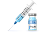 A Syringe filled with the COVID-19 vaccine next to a vile of the vaccine with a label "COVID-19 Vaccine"