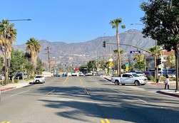 Photo taken from the middle of the street pointing north towards the mountains at the intersection of Pacific and Arden