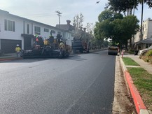 photo of a crew working on a paved street