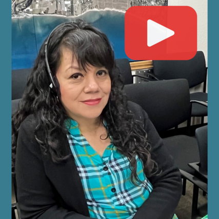 Maria V. with headset for interpretation and play button