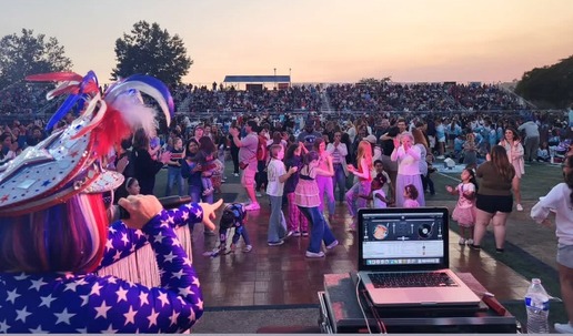 DJ Darla Bea points to the crowd 