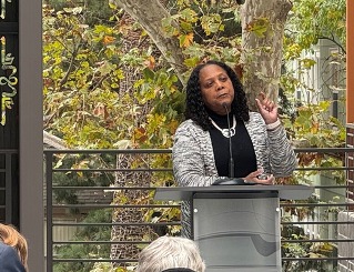 Executive Director Tiena Johnson Hall speaking during the Grand Opening Celebrations