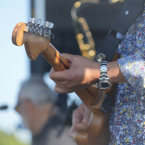 man playing guitar on stage