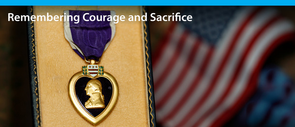 purple heart medal and american flag