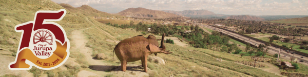 Woolly Mammoth metal sculpture at Jurupa Mountains overlooking Jurupa Valley at 60 freeway; City's 15th Anniversary logo
