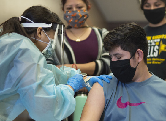 A young man getting a flu vaccination.
