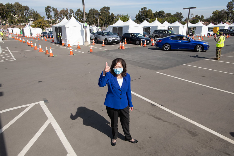 Supervisor Solis standing in the parking lot of Cal State LA's mass vaccination site