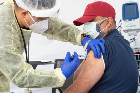 A community member prepares receives the COVID-19 vaccine.