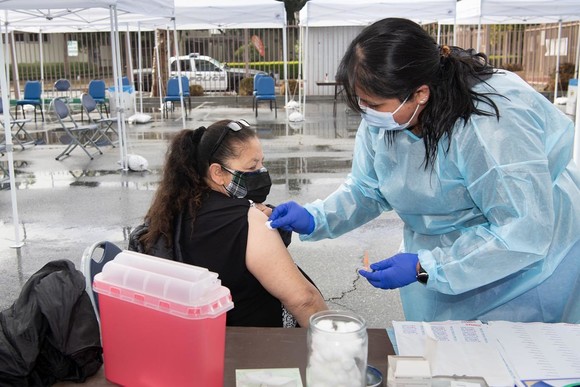 An El Monte resident receives the COVID vaccine