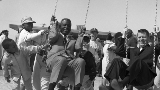 Dodgers legend Jackie Robinson enjoys the swings while attending the dedication of Jackie Robinson Park in Sun Village in 1965. The park is now host to one of the oldest Juneteenth celebrations in Southern California. Photo courtesy of Los Angeles County Department of Regional Planning.