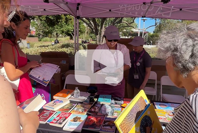 People gathered next to books