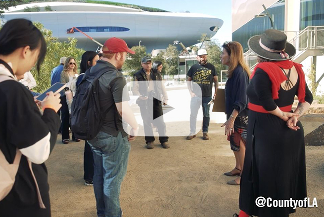 Group of people gathered in front of two new Commons buildings at the Natural History Museum