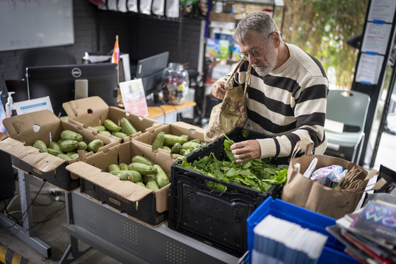 Patron selecting food at the Los Angeles LGBT Center's Senior Food Pantry