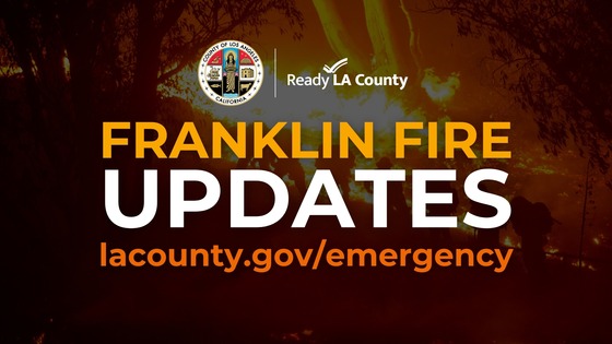 Bright orange fire in the dark with trees in the background and County of Los Angeles seal with text Franklin Fire Updates