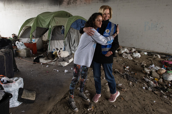 Hahn hugs woman during encampment resolution in Long Beach