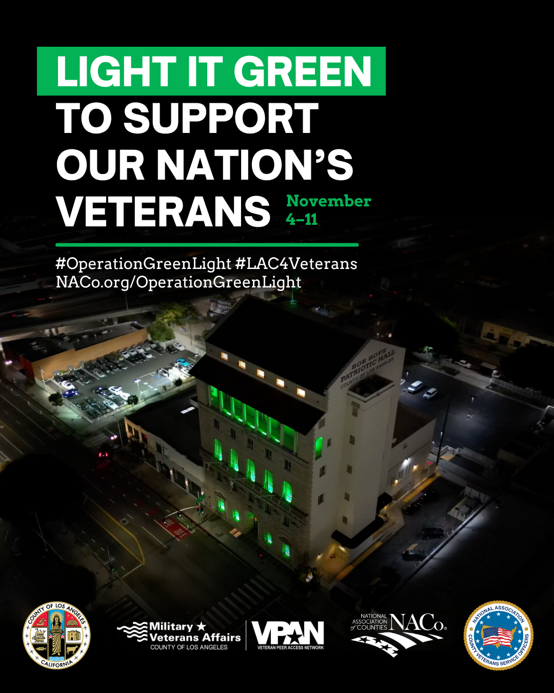 A night view of Bob Hope Patriotic Hall in downtown Los Angeles illuminated with green lights as part of Operation Green Light