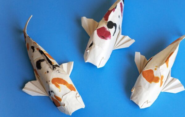 White fish art pieces with blue background