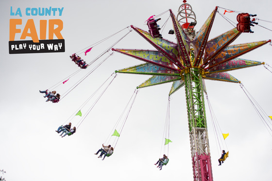 LA County Fair visitors spin high on swings on the Sky flyer attraction